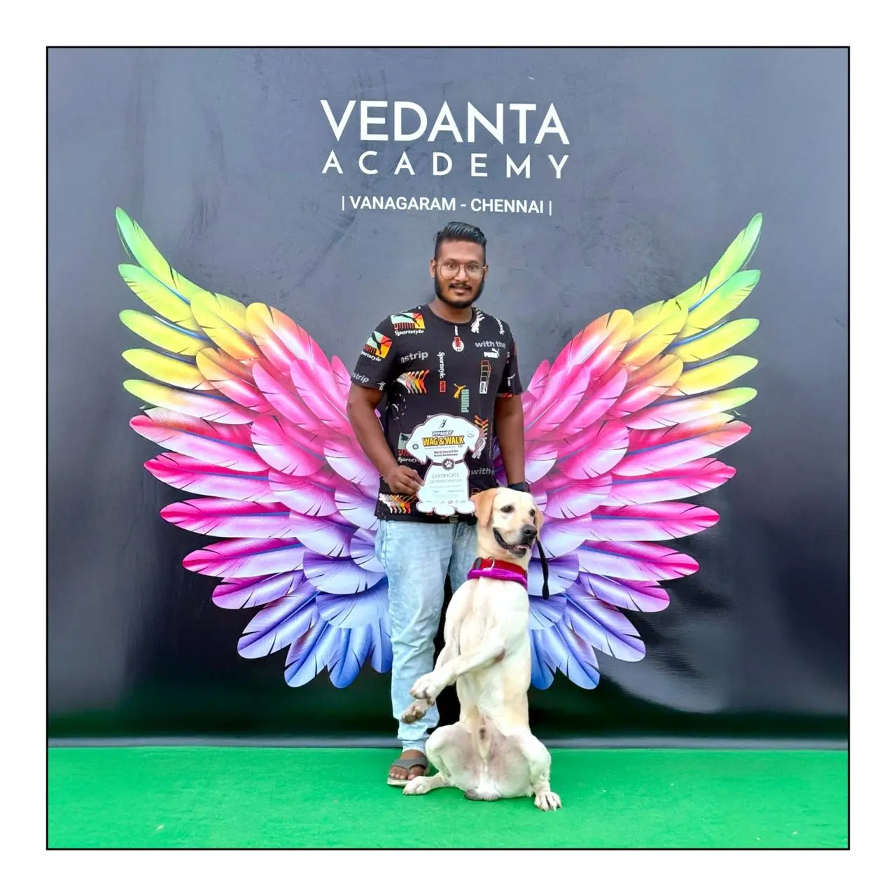 Praveen Shankar with a dog at a canine event